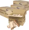 Several cardboard boxes of firewood are stacked, with one box open showing firewood logs inside. Some loose logs are in the foreground. Náhľad obrázku produktu