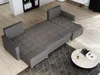 A grey sectional sofa is displayed in a modern living room setting, with a coffee table in the foreground. Podgląd zdjęcia produktu