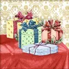 A collection of Christmas gift boxes arranged on a red tablecloth, with a decorative gold damask wallpaper in the background. Produktbild-Vorschau