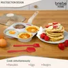 A multi-section frying pan with food being cooked in it, along with a stack of pancakes and strawberries on a plate, and cooking utensils. Náhľad obrázku produktu