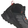 Close-up view of a black and gray hiking boot with orange accents. Produktbild-Vorschau