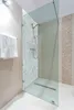 A modern bathroom with a glass shower enclosure. Produktbild-Vorschau
