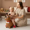 A mother and child playing with a toy dog in a room. Náhled obrázku produktu