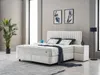 A bedroom setting with a bed, nightstand, and plant. Produktbild-Vorschau