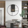 A modern dining room with a minimalist clock on the wall. Produktbild-Vorschau
