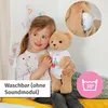A young girl is holding a teddy bear. Anteprima dell’immagine prodotto