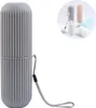 A gray toothbrush holder is shown on a white background, with a smaller inset image showing multiple toothbrush holders in different colors and a toothbrush in a cup. Produktbild-Vorschau