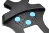 Close-up view of the underside of a black shoe grip with blue studs. Produktbild-Vorschau
