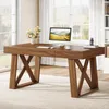 A wooden desk with a computer and flowers in a bright room. Anteprima dell’immagine prodotto