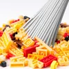 A pile of small building blocks with a set of thin, gray rods inserted into them. Produktbild-Vorschau