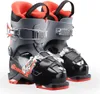 A pair of black and gray children's ski boots with red accents. Produktbild-Vorschau
