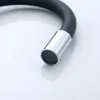 A close-up shot of the spout of a black flexible kitchen faucet with a chrome finish. Náhľad obrázku produktu