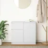 A white sideboard with two drawers and a cabinet door, placed against a white wall. A large round mirror hangs on the wall above the sideboard. A potted plant is on the left, and a coat rack with a coat and bag is on the right. Voir les images du produit