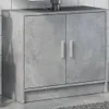 A concrete-effect cabinet with two doors and silver handles, shown in a bathroom or utility room setting. Produktbild-Vorschau
