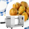 A spiral potato cutter is shown in the foreground, with a plate of spiral-cut potatoes in the background. Náhľad obrázku produktu