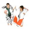 Two children are holding large, plush pillows that resemble a panda. Náhľad obrázku produktu