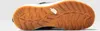 The image shows the sole of a black boot with a tan rubber sole and a white midsole. The North Face logo is visible on the sole. Podgląd zdjęcia produktu