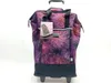 A rolling shopping bag with a floral pattern. Voir les images du produit