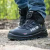 A person wearing HKS safety boots while walking outdoors. Produktbild-Vorschau
