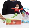 A child's hands are playing with a toy called Looping Louie. The toy is set up on a white table. Produktbild-Vorschau