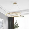 A modern chandelier hanging from a white ceiling. Produktbild-Vorschau