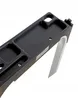 A close-up view of a black plastic component with several compartments and a silver metal support. Podgląd zdjęcia produktu