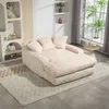 A beige corduroy sofa with three cushions is placed on a rug in a well-lit room with a large window. Náhled obrázku produktu