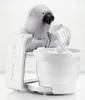 A white stand mixer with a whisk attachment is shown against a white background. The mixer has a bowl with whipped cream in it. Produktbild-Vorschau