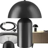A collage of images showing a black mushroom-shaped table lamp, its charging cable, and a lifestyle shot of the lamp on a cabinet. Náhled obrázku produktu