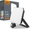 A Videx LED floodlight with a motion sensor is shown next to its packaging. Produktbild-Vorschau