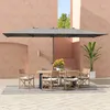 An outdoor patio scene with a dining set under a large umbrella. Náhľad obrázku produktu