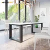 A modern dining room with a white table and chairs, large windows with greenery outside, and a contemporary chandelier. Produktbild-Vorschau