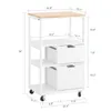 A white kitchen cart with a wooden top, shown with dimensions indicated by measurement lines and numbers. Náhled obrázku produktu