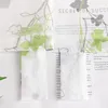 A close-up view of a transparent curtain with a floral pattern and text printed on a white background. Produktbild-Vorschau