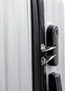 A close-up view of a silver suitcase's zipper and combination lock. Produktbild-Vorschau