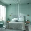 A bedroom with a bed, nightstands, and decorative elements. Produktbild-Vorschau