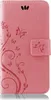 A pink flip cover for a Huawei P Smart 2019 / Honor 10 Lite phone, decorated with a floral and butterfly motif. Produktbild-Vorschau