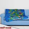 A Minecraft-themed blanket is draped over a blue sofa. Anteprima dell’immagine prodotto
