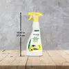 A spray bottle of cleaning product is shown on a wooden surface against a textured gray wall. Produktbild-Vorschau