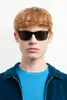 A man wearing sunglasses and a blue shirt. Náhľad obrázku produktu