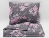 A folded duvet and pillow with a floral pattern on a white background. Náhled obrázku produktu