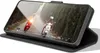 A smartphone in a black flip case is displayed, showing a video of two people riding scooters on a road. Anteprima dell’immagine prodotto