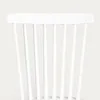 The back of a white chair with vertical slats. Produktbild-Vorschau
