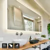 A modern bathroom with a large LED mirror above two sinks and a wooden countertop. Produktbild-Vorschau