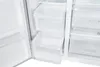 Close-up view of the interior of a refrigerator with clear drawers. Podgląd zdjęcia produktu