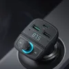 A close-up shot of a black car charger with multiple USB ports and a digital display, plugged into a car's power outlet. Anteprima dell’immagine prodotto