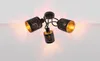 A black ceiling light with three adjustable spotlights, each with a gold interior and a decorative pattern. Náhled obrázku produktu