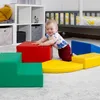 A baby playing with colorful foam blocks in a nursery or playroom. Produktbild-Vorschau