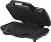 An open black waffle maker with ridged cooking plates. Podgląd zdjęcia produktu