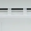 A close-up view of white sheer curtains with fabric loops attached to a black curtain rod. Produktbild-Vorschau